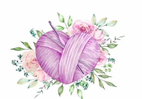 Purple ball of yarn wrapped with pink and cream flowers and green foliage arranged around it