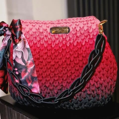 Pink and red ombré quilted handbag with black chain strap and decorative floral scarf charm