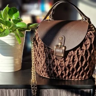 Brown quilted shoulder bag with chain strap and gold buckle