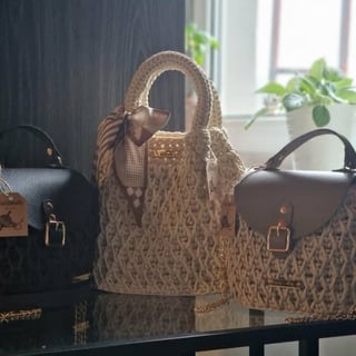Collection of designer handbags displayed on shelf